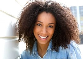 cheerful-young-african-american-woman-PZQTU5RRE