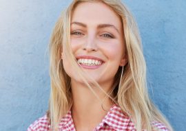 cheerful-young-woman-looking-at-camera-and-PX5UHQ2