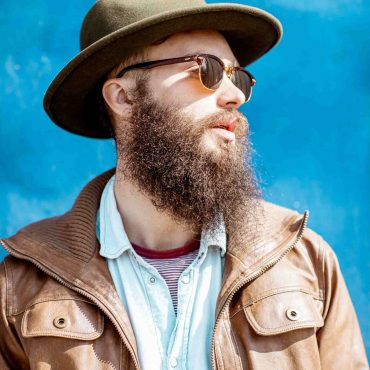 portrait-of-a-stylish-man-on-the-colorful-backgrou-ZXGKRV2