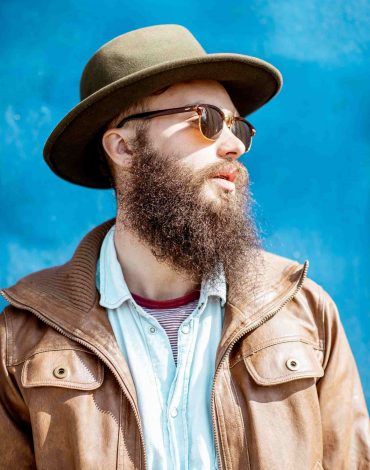 portrait-of-a-stylish-man-on-the-colorful-backgrou-ZXGKRV2