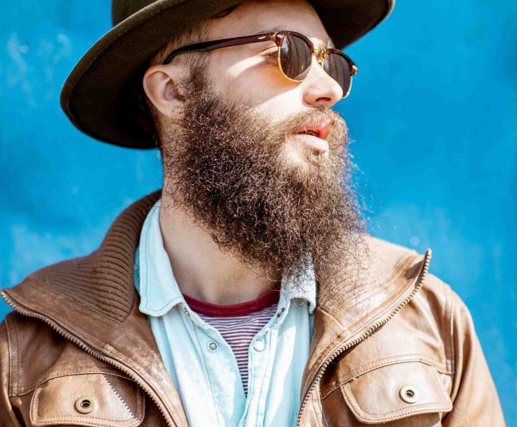 portrait-of-a-stylish-man-on-the-colorful-backgrou-ZXGKRV2
