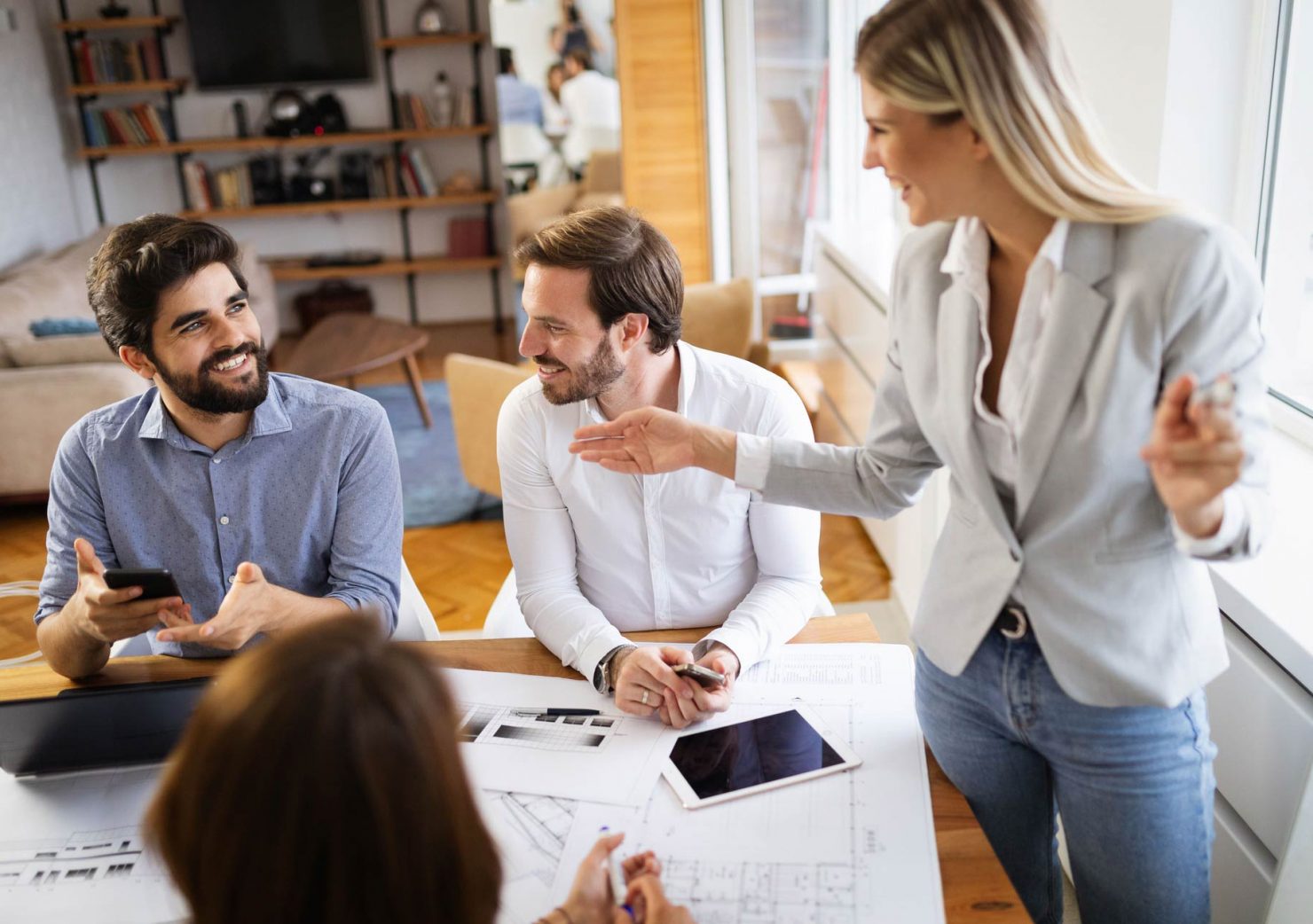 group-of-business-people-meeting-in-office-sharing-Q69Q9CE