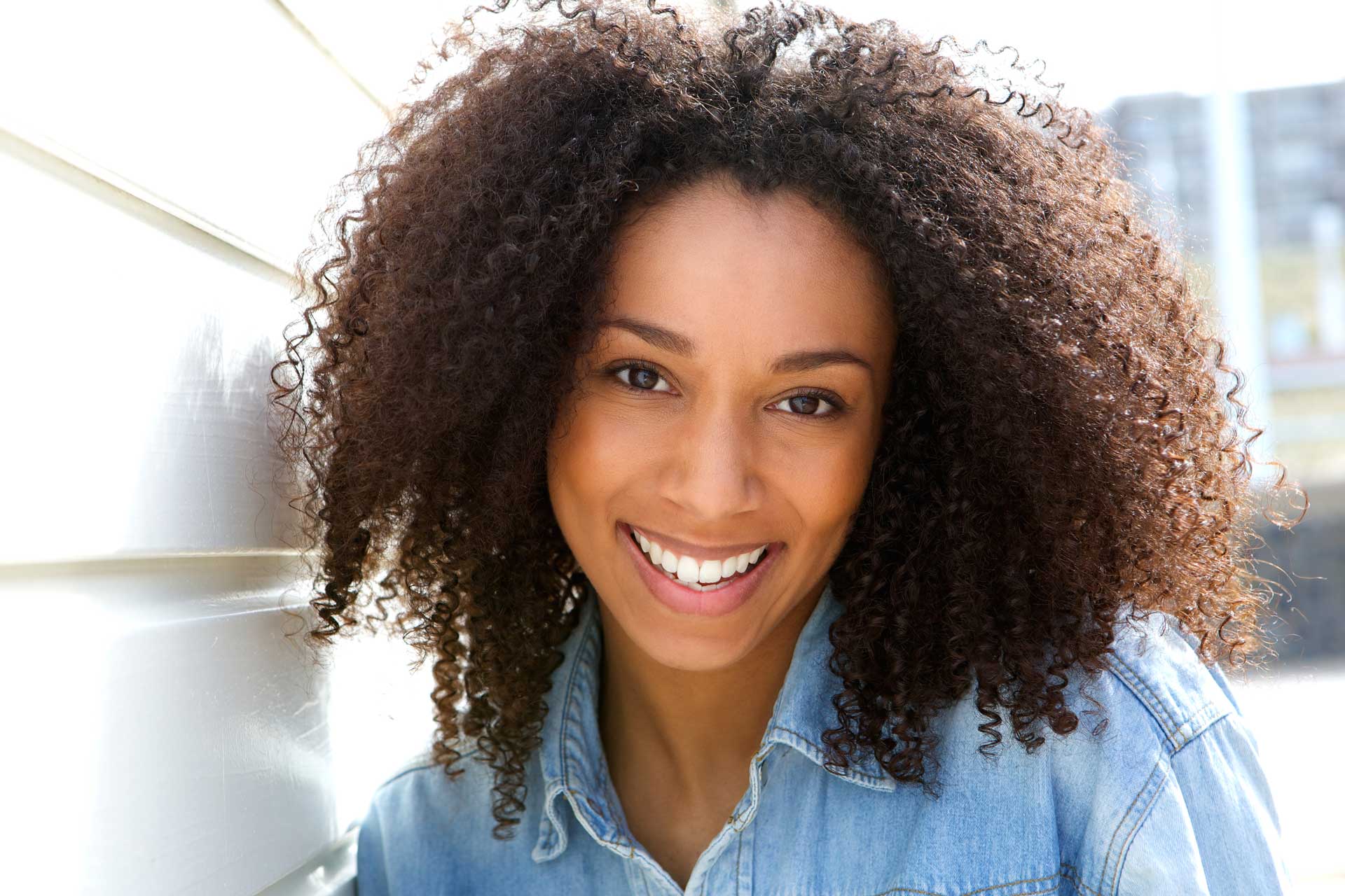 cheerful-young-african-american-woman-PZQTU5RRE